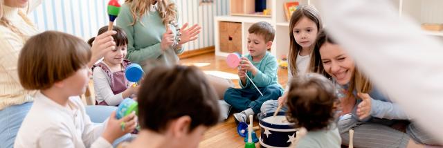 Parents taking part in the activities for preschool children. Healthy learning environment. Teacher and parents working together.